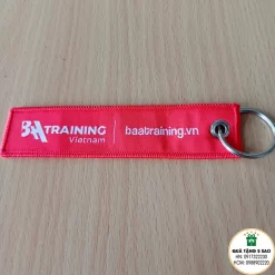 Móc khóa vải dệt BAA Training sản xuất theo yêu cầu